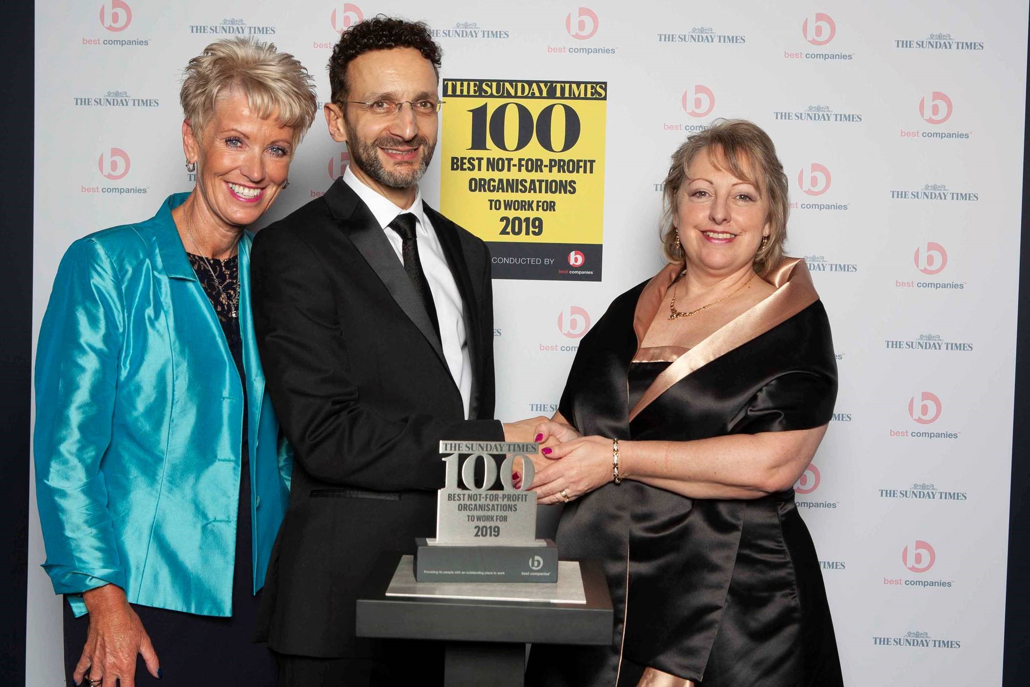 Liz accepting award from the Sunday Times 2019 